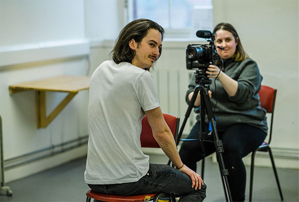 Adults filming